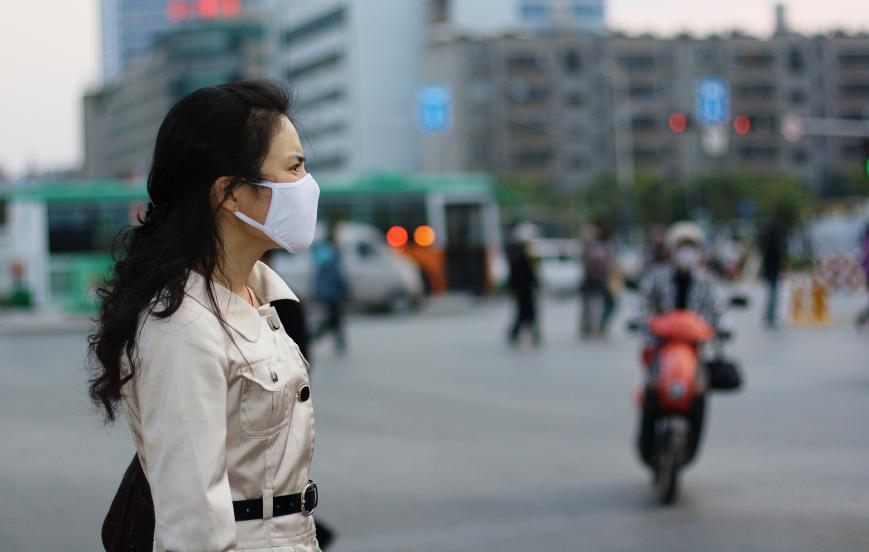 Woman wearing mask on street
