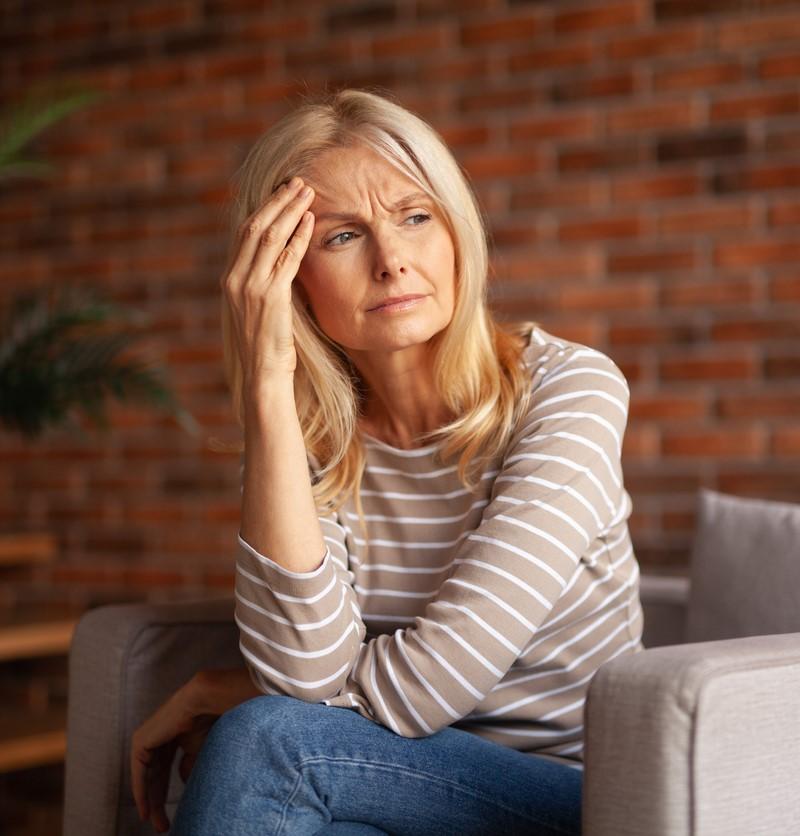 Woman with headache and brain fog