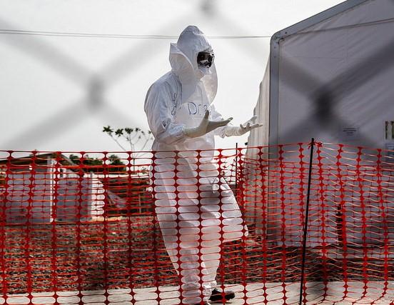 Worker wearing protective equipment at Ebola treatment center