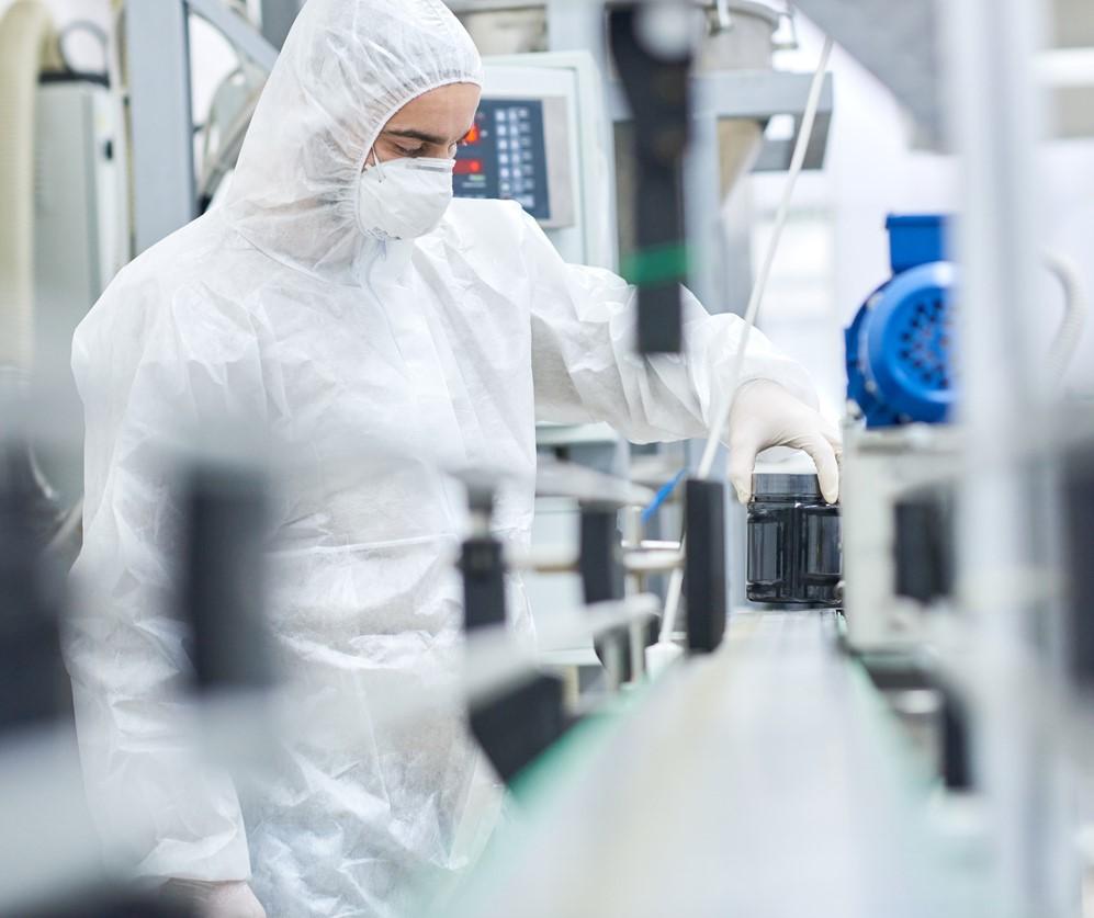 Worker on drug production line