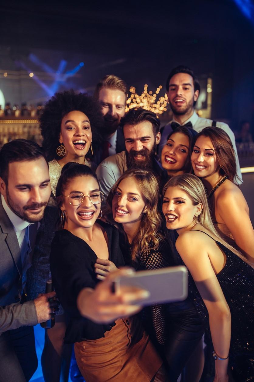 Young adult selfie at bar