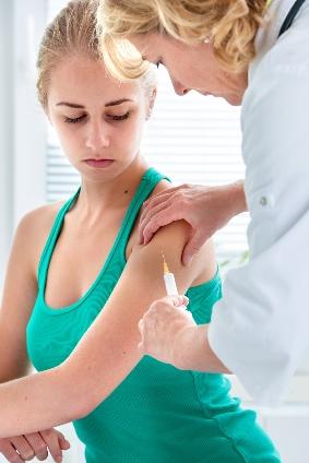 Young adult being vaccinated