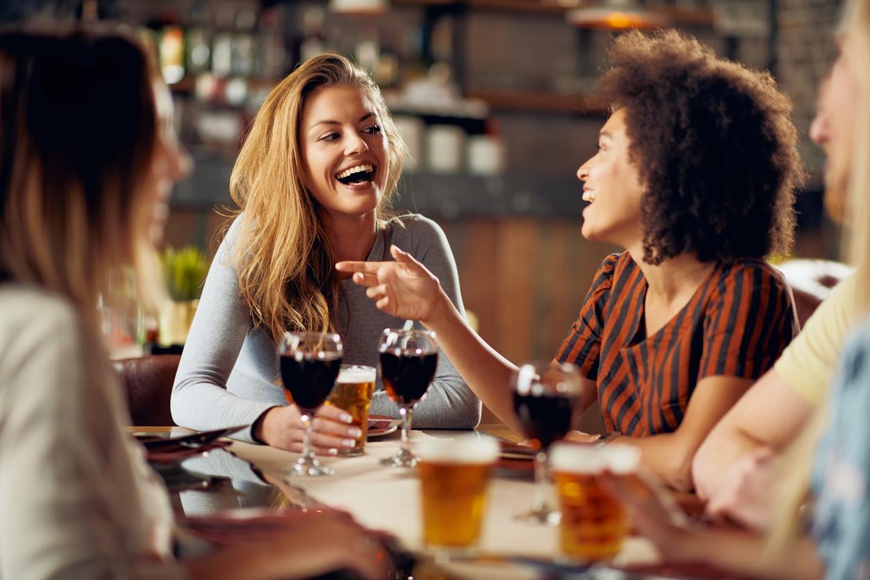 Young adults dining indoors without masks