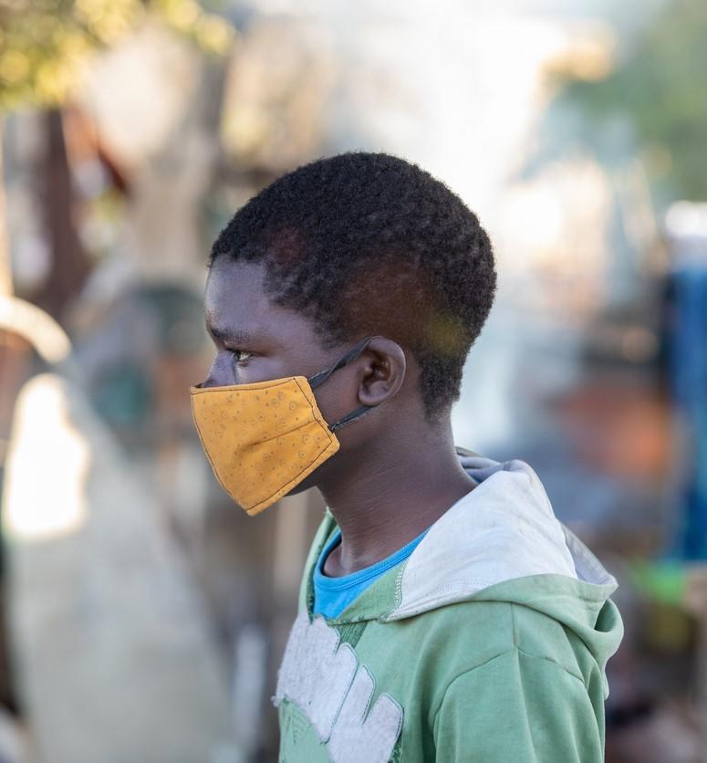 Young African man wearing mask