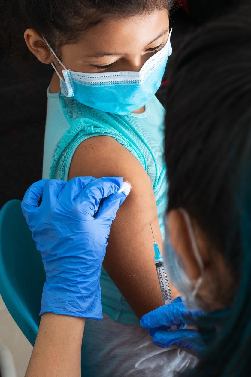 Young girl getting shot in arm