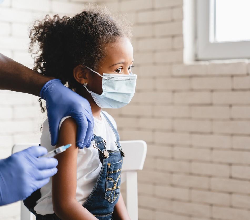 Young girl getting vaccinated