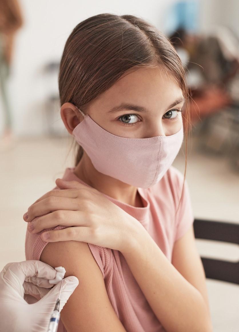 Young girl getting vaccine