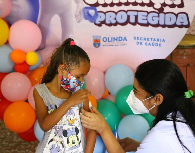 Young girl getting vaccinated