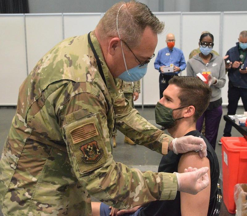 Young man getting COVID vaccine
