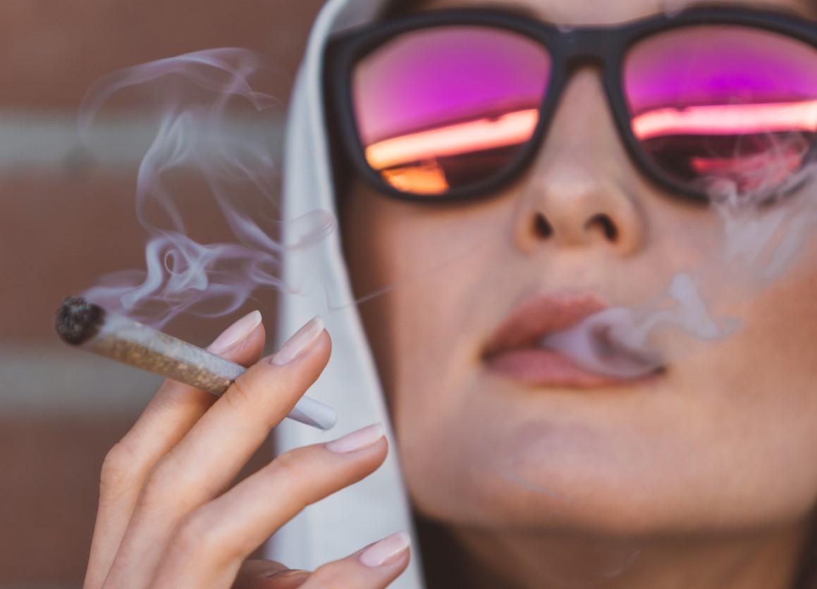 Woman smoking marijuana joint