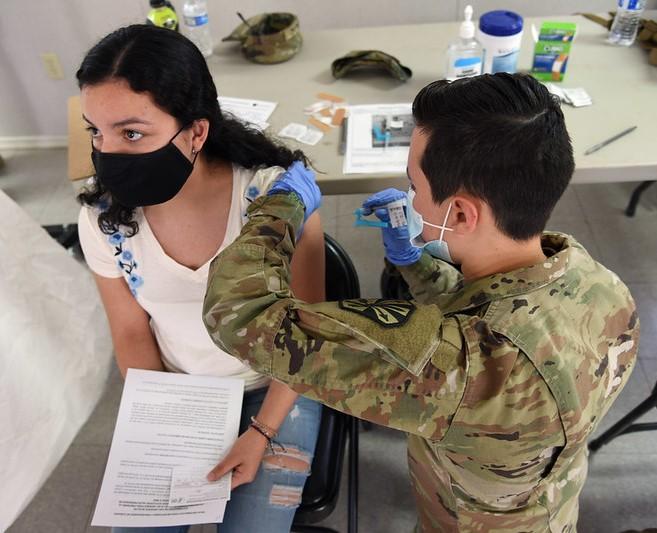 Young woman getting COVID-19 vaccine