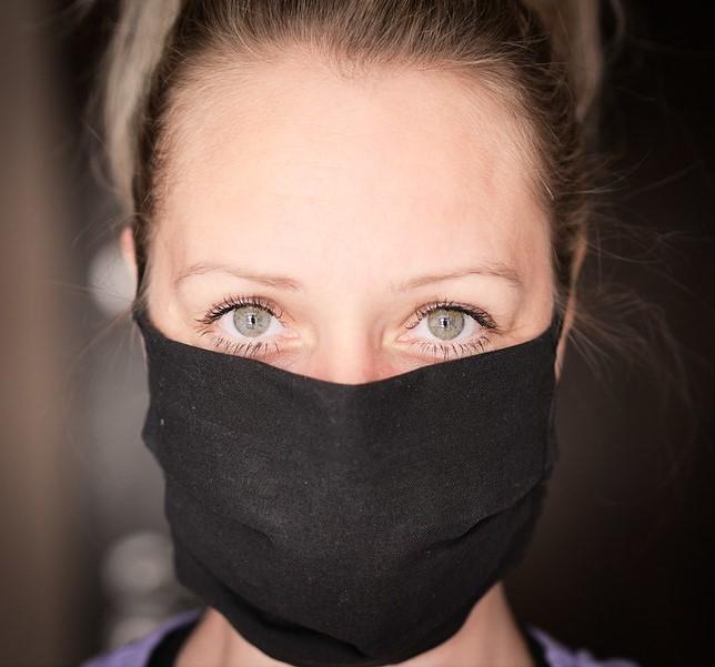 Woman wearing black mask