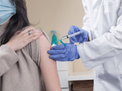Woman getting vaccinated against COVID-19