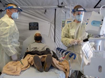 Doctors administering monoclonal antibody therapy