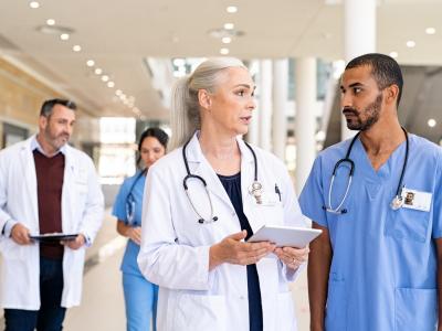 Doctors consulting with nurses
