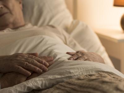 Elderly woman sick in bed