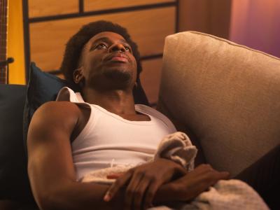 Exhausted young man on couch
