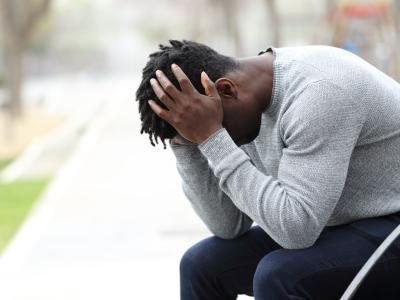 Fatigued man on park bench