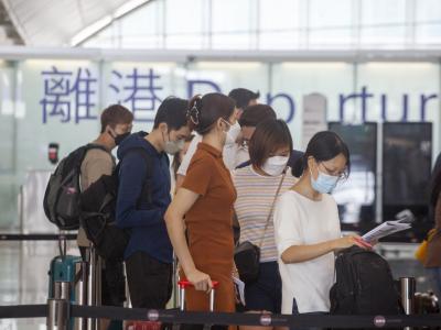 Airport passengers with masks
