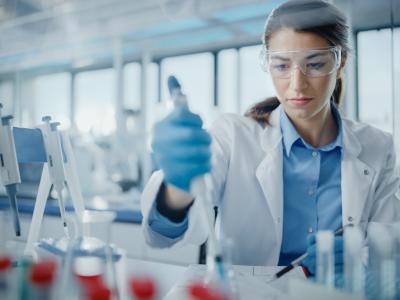 Lab scientist pipetting