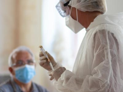 Older man about to receive COVID vaccine