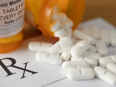 Pills spilling from bottle