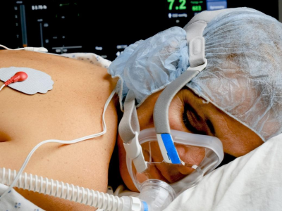 Woman in prone position in hospital