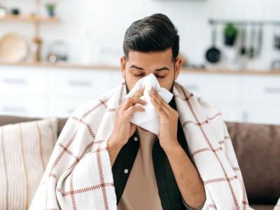 sick guy on couch congested