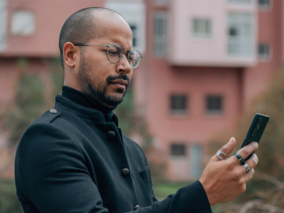 Skeptical man looking at phone