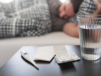 Sleeping man meds on nightstand