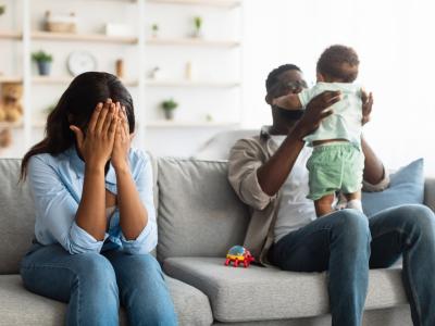 Stressed mom and dad with baby