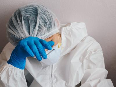 Tired healthcare worker wearing N95