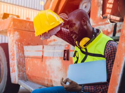 Tired worker with hardhat