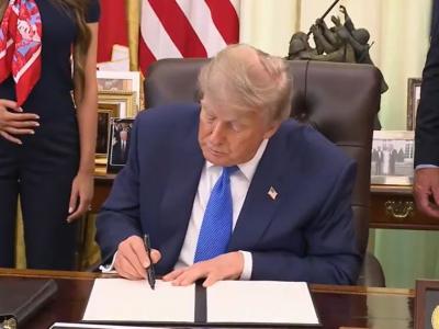 President Donald Trump signs an Executive Order on vaccines on Aug. 10, 2026.