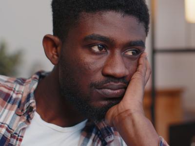 Unhappy young Black man