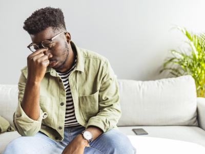 Weary young man on couch