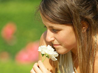 Woman smelling flower
