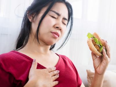 Woman eating sandwich