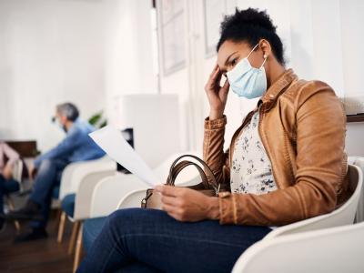 Woman wearing mask in waiting room