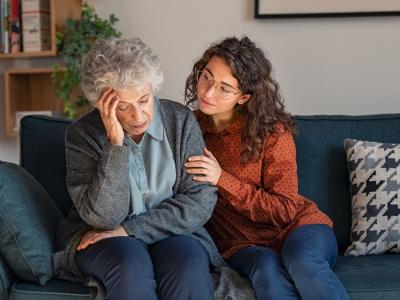 Young woman consoling older woman