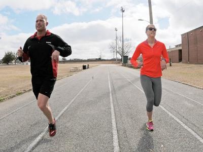 Couple running on track