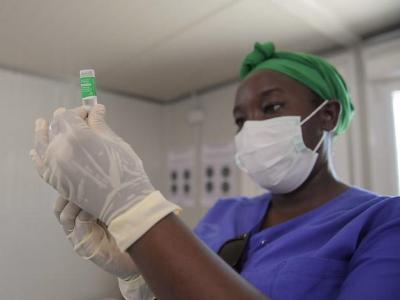 Healthcare worker drawing up syringe