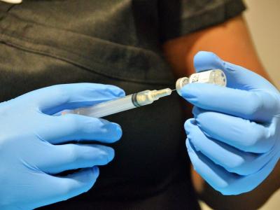 consulting case study vaccine health worker drawing vaccine