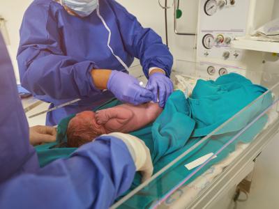 Doctor vaccinating newborn