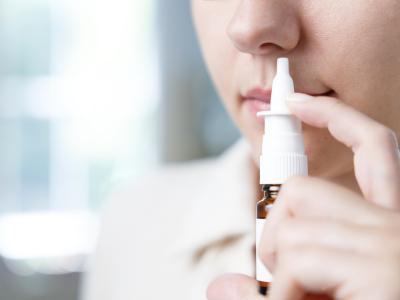 Person using nasal spray