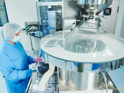 Person working in drug-manufacturing facility