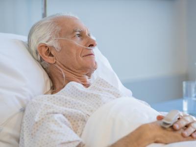 Older man in hospital bed