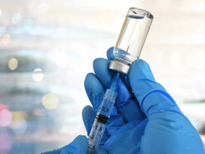 Healthcare provider drawing up vaccine