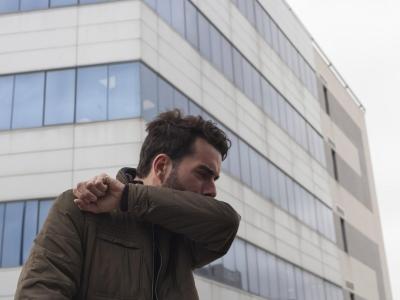 man coughing 