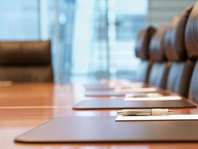 Conference table with empty chairs